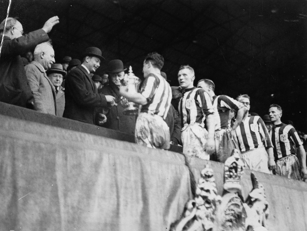 Granting of the FA cup to the "West Bromwich Albions" soccer team. Wembley. London, England. Photograph. April 25th 1931.